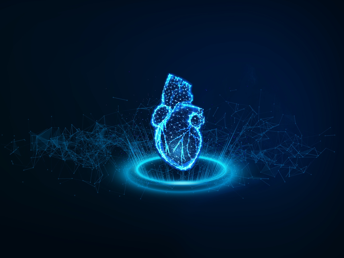 Futuristic blue hologram of a human heart projected from a circular platform, set against a dark, tech-inspired background.
