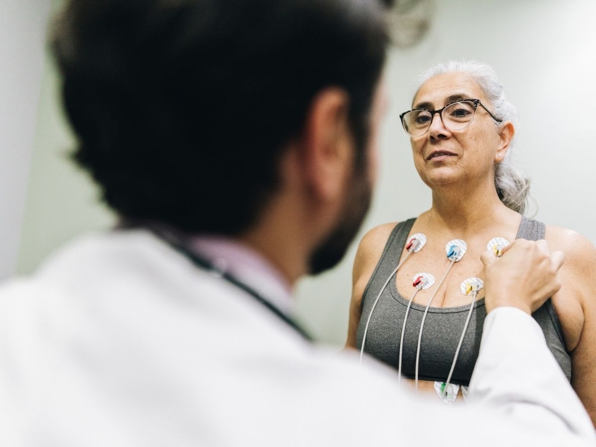 Patient talking with her doctor during a cardiopulmonary stress test on a hospital